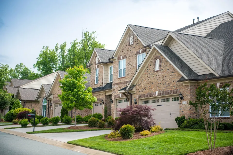 Commercial HOA community landscaping — maintained entrance and grounds.