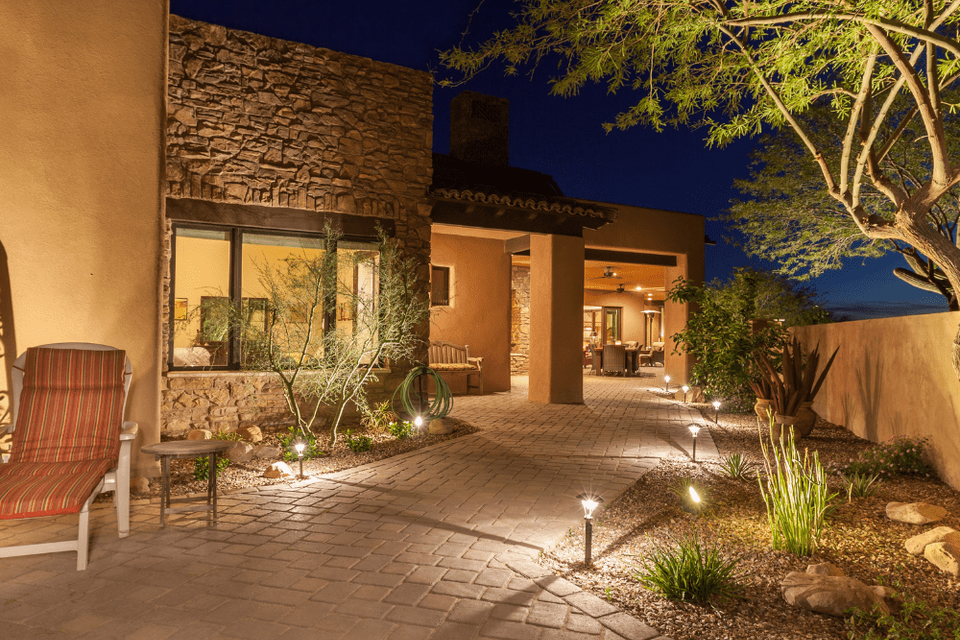 Landscape lighting installed on a commercial property (nighttime visibility).