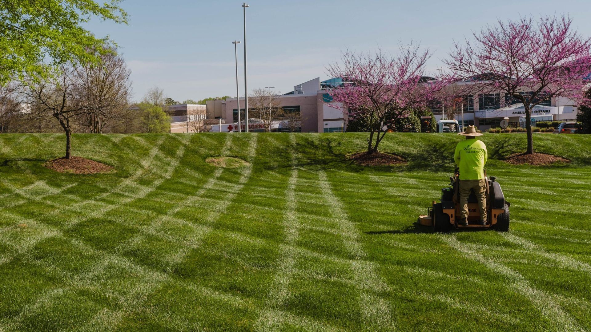 Commercial grounds mowing and turf care in progress.